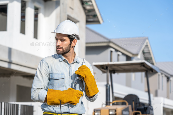 Construction Worker Wearing Safety Harness And Safety Line Working At 