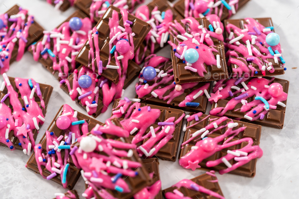 Mini pink chocolates Stock Photo by arina-habich