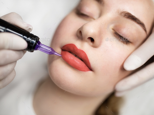 Beautiful Girl Model is Lying on the Lip Tattoo Procedure the Master  Applies Anesthesia To the Lips with a Small Brush Stock Image - Image of  applying, needle: 231485599