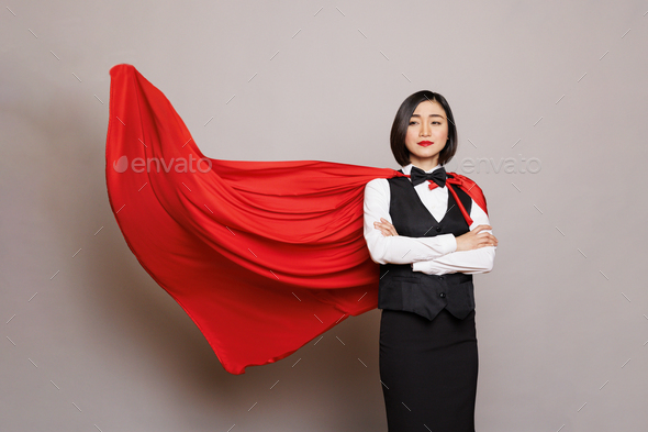 Confident waitress in superman red cape