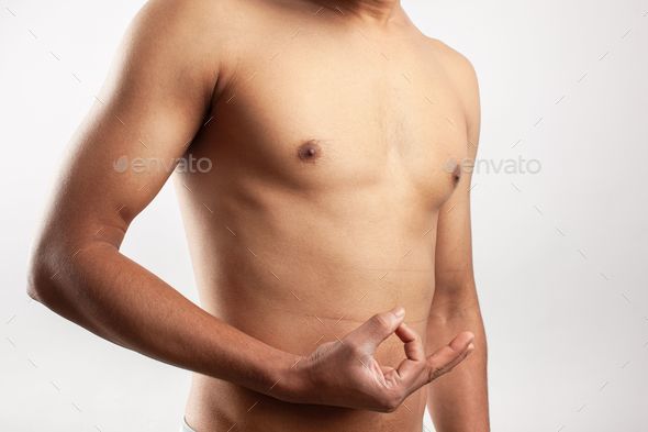 shirtless fit man showing gyan mudra meditation gesture