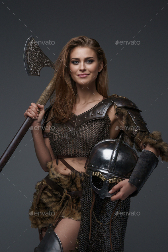 Stunning Viking model dressed in chainmail armor and fur Stock