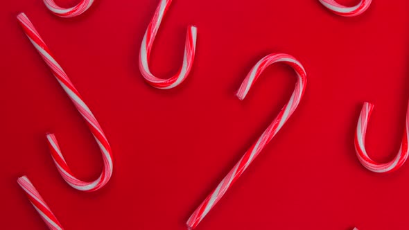 Rotating Red Christmas or New Year Background in Traditional Candy Cane