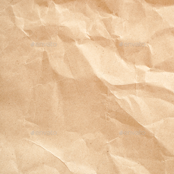 Old wrinkled brown craft paper poster texture. Blank creased