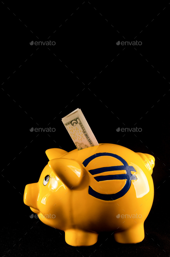 Vertical shot of a yellow pig cashbox with a euro sign and a 2 dollar banknote on a black background