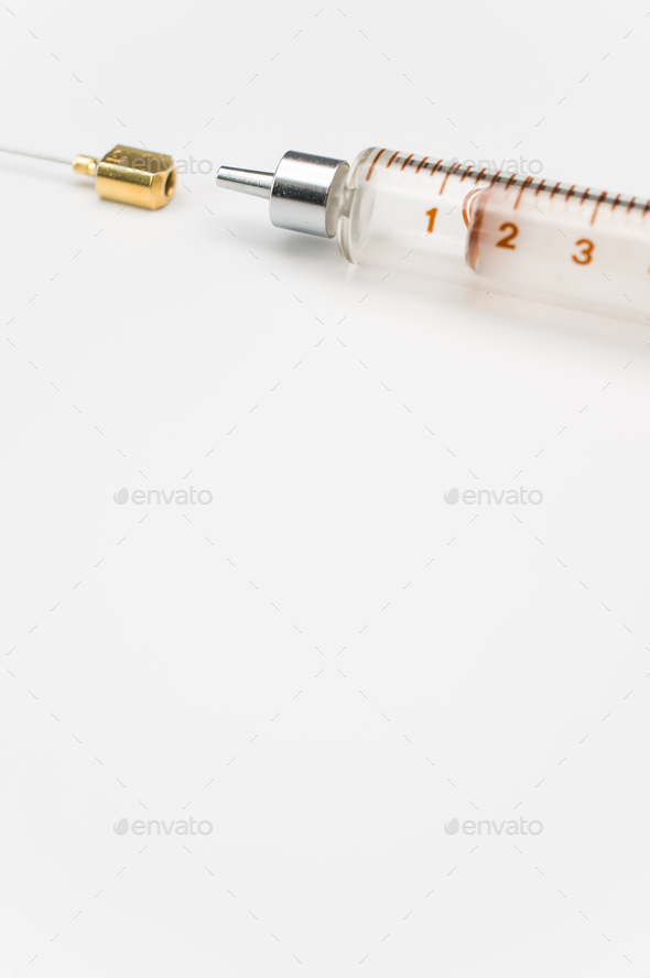 isolated sterilized glass injection syringe on a white paper background