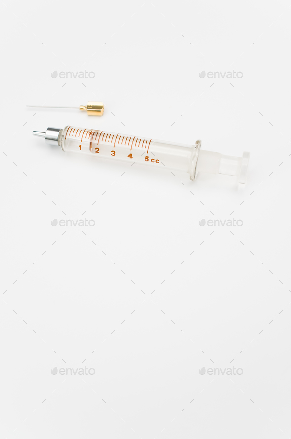 isolated sterilized glass injection syringe on a white paper background