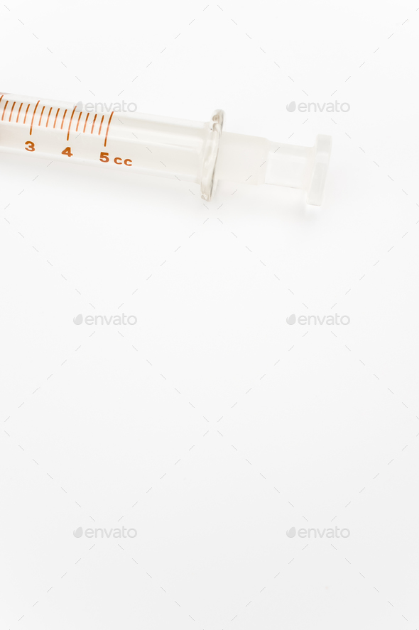 isolated sterilized glass injection syringe on a white paper background