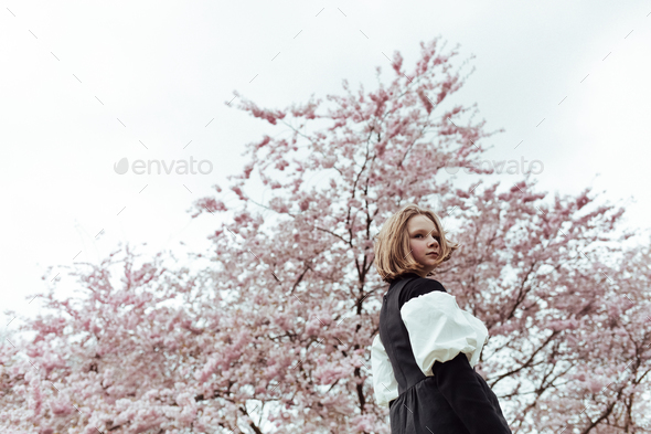 Side view of girl standing at park stock photo