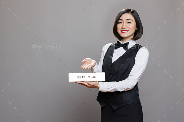 Hotel employee showing reception plate