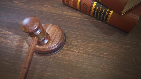 Hardwood gavel hitting sound block in court of law. Symbol of justice, judgement alt