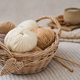 A wicker basket with yarn and a cup of coffee on the bed. Hygge lifestyle. Handicraft day concept - PhotoDune Item for Sale