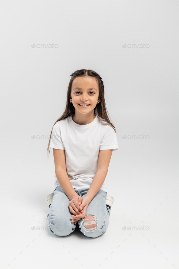 Happy Woman Smiling, Wearing A Grey Long Sleeve T-shirt And