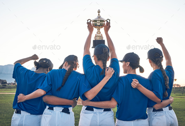 Baseball, trophy and team celebrate win with women outdoor on a pitch for sports competition. Behin