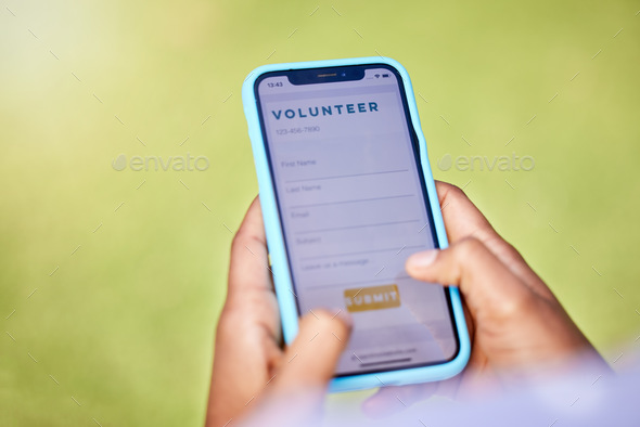 Phone screen, volunteer and hands, register online for charity and NGO with help, donation and mobi