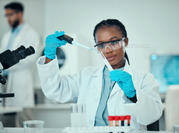 Science, blood and research, black woman with test tube in laboratory and medical engineering solut