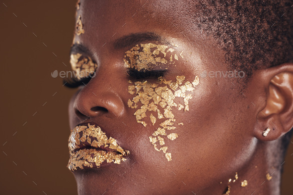 Art, beauty and black woman with gold makeup on brown background