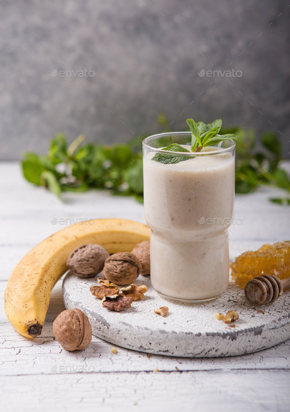 Healthy breakfast. Banana walnuts smoothie with collagen, coconut milk in glass jar