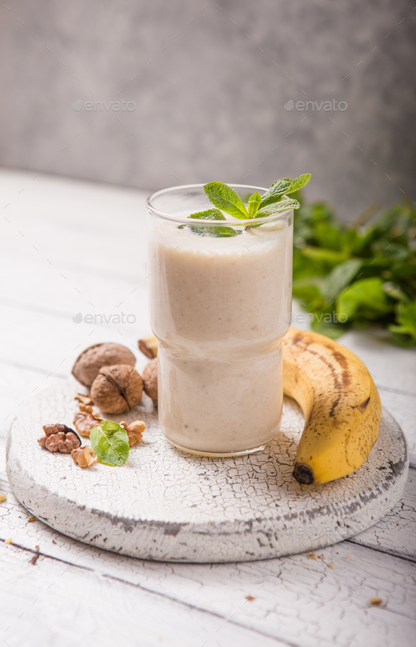Healthy breakfast. Banana walnuts smoothie with collagen, coconut milk in glass jar