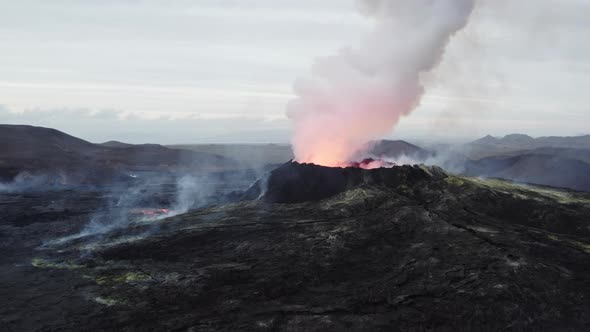 Drone Flight Towards Smoking Volcano In Burning Landscape alt