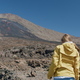 Teide, Tenerife, Canary islands, Spain. Young woman hiking along the volcanic sand among lava rocks - PhotoDune Item for Sale