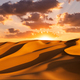 Sunset over the sand dunes in the desert. Arid landscape of the desert. - PhotoDune Item for Sale