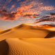 Sunset over the sand dunes in the desert. Arid landscape of the desert. - PhotoDune Item for Sale