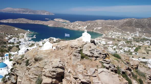 Aerial view from top of Chora village. Greek flag, sea and town view alt