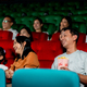 Asian family with father, mother and daughter enjoy and happy to watch movie together in theater - PhotoDune Item for Sale