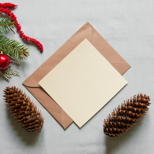 Christmas still festive life. Blank invitation mockup, envelope on textile  background. Fir branches Stock Photo by olenasvechkova