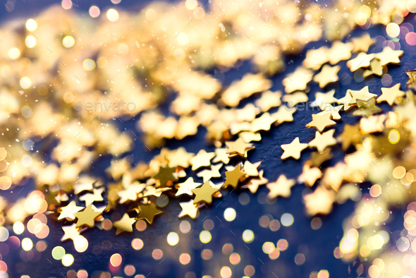 Gold glitter confetti abstract blue background, luxury New Year backdrop  with golden stars. Stock Photo by olenasvechkova