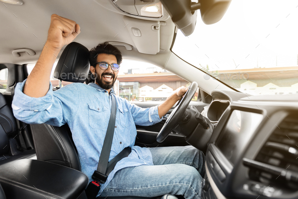Portrait of young stylish indian man model pose in street in sunglasses  against car. 10459589 Stock Photo at Vecteezy