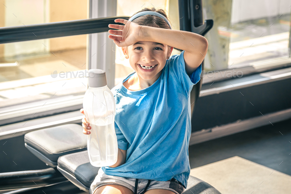 Sporty Teen With A Water Bottle After Exercise Stock Photo