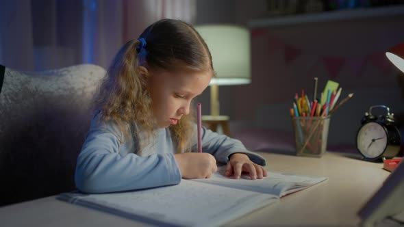 Schoolgirl Junior School Does Homework In The Evening alt