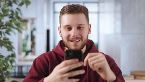 Man Using Smartphone in Office