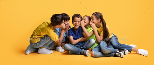 kids whispering a secret