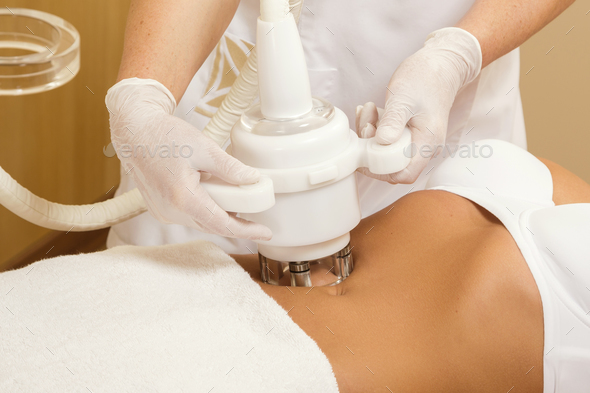 Woman and belly massage or figure correction procedure