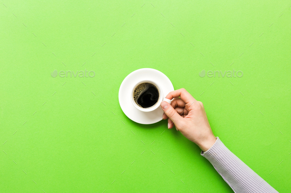 A female hand holding coffee cup, blank - Stock Illustration