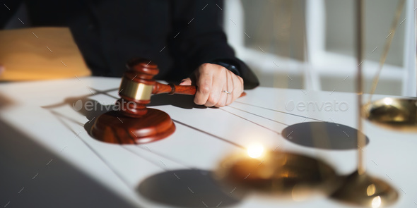 Lawyer's hand concept justice with judge gavel, Businessman in suit or Hiring lawyers in the