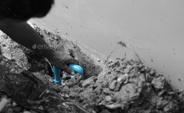 Broken water pipe blue color underground in the house