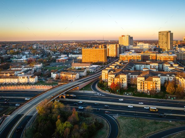 Aerial cityscape view in New Brunswick, New Jersey with Rutgers University  during sunrise Stock Photo by wirestock
