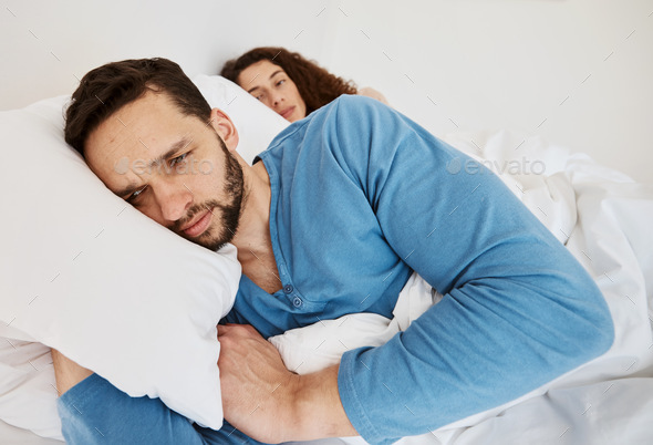 Divorce, fight and angry couple in bed after fight, discussion or frustrated by cheating wife at ho