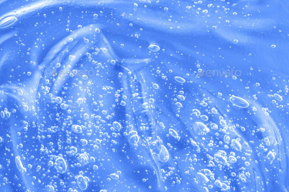 Liquid antibacterial disinfect smear smudge. Hyaluronic acid clear serum sample. Cosmetic blue gel