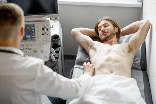 Man during an ultrasound diagnosis of the lower abdomen