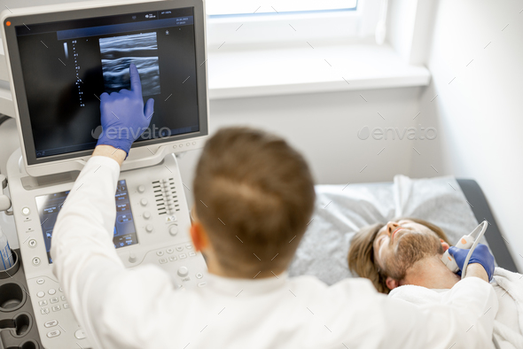 Man during an ultrasound diagnosis of the carotid artery