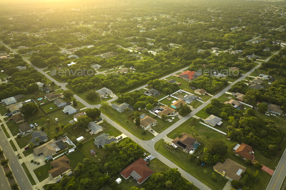 Aerial view of street traffic with driving cars in small town America suburban landscape