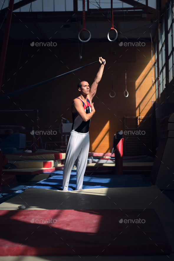 Young sports gymnast stretching with a rubber band in the gymnas Stock