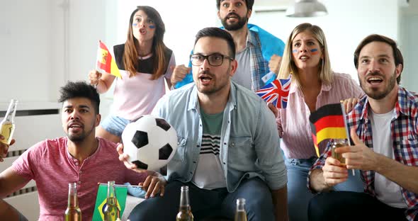 Friends or Football Fans Watching Soccer on Tv and Celebrating Victory at Home