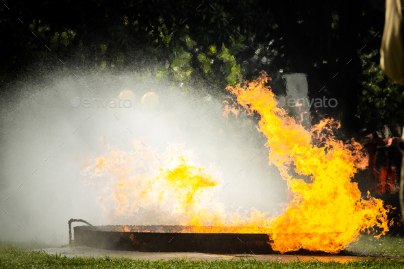 Fire flame in a firefighting training exercise. Firefighter training ...