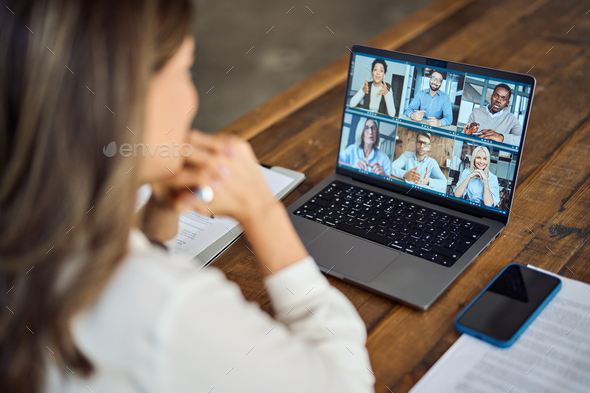 Business woman team leader having hybrid office group meeting video call.